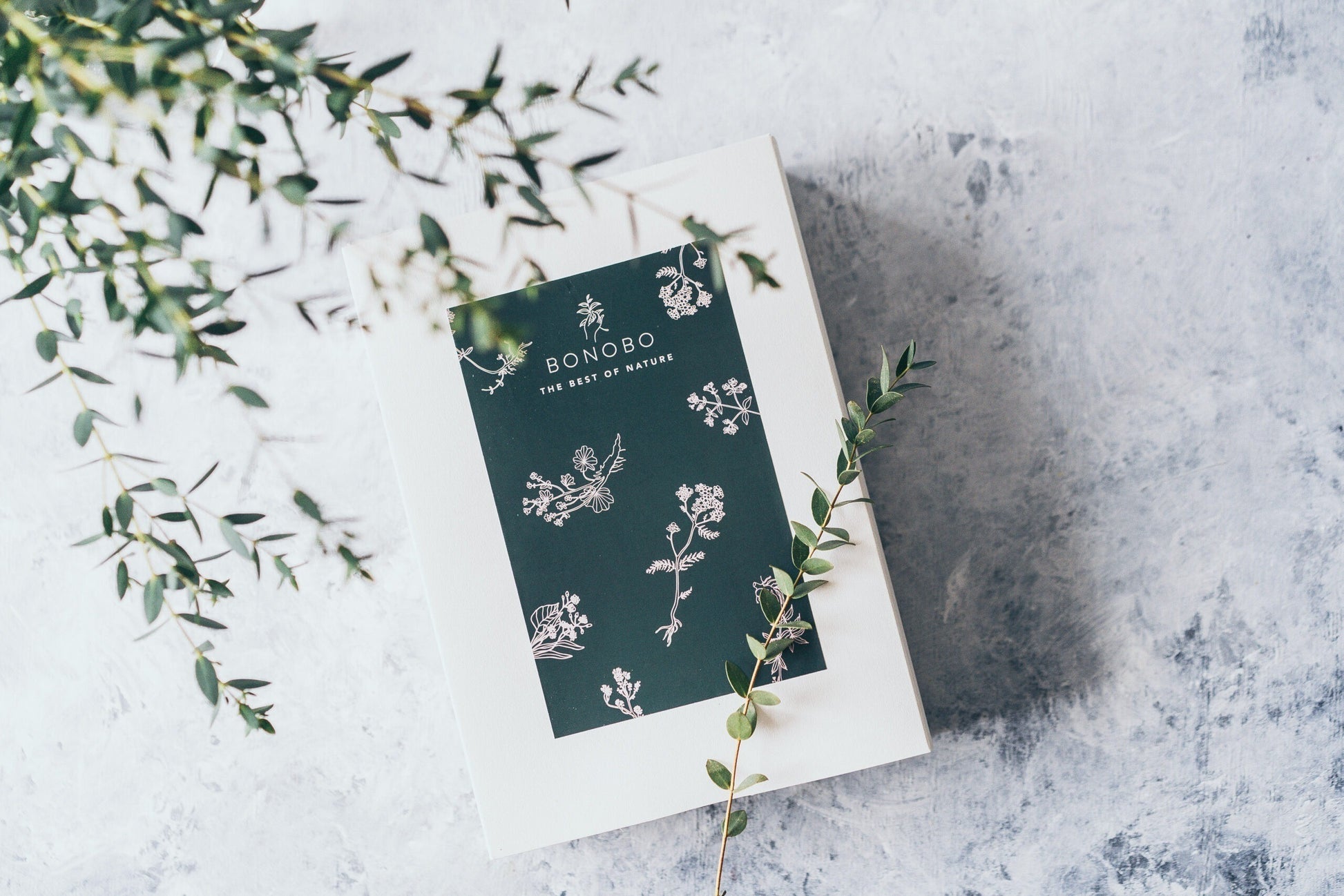 elegant gift box of four natural body scrubs open to reveal the raspberry and grapefruit scent