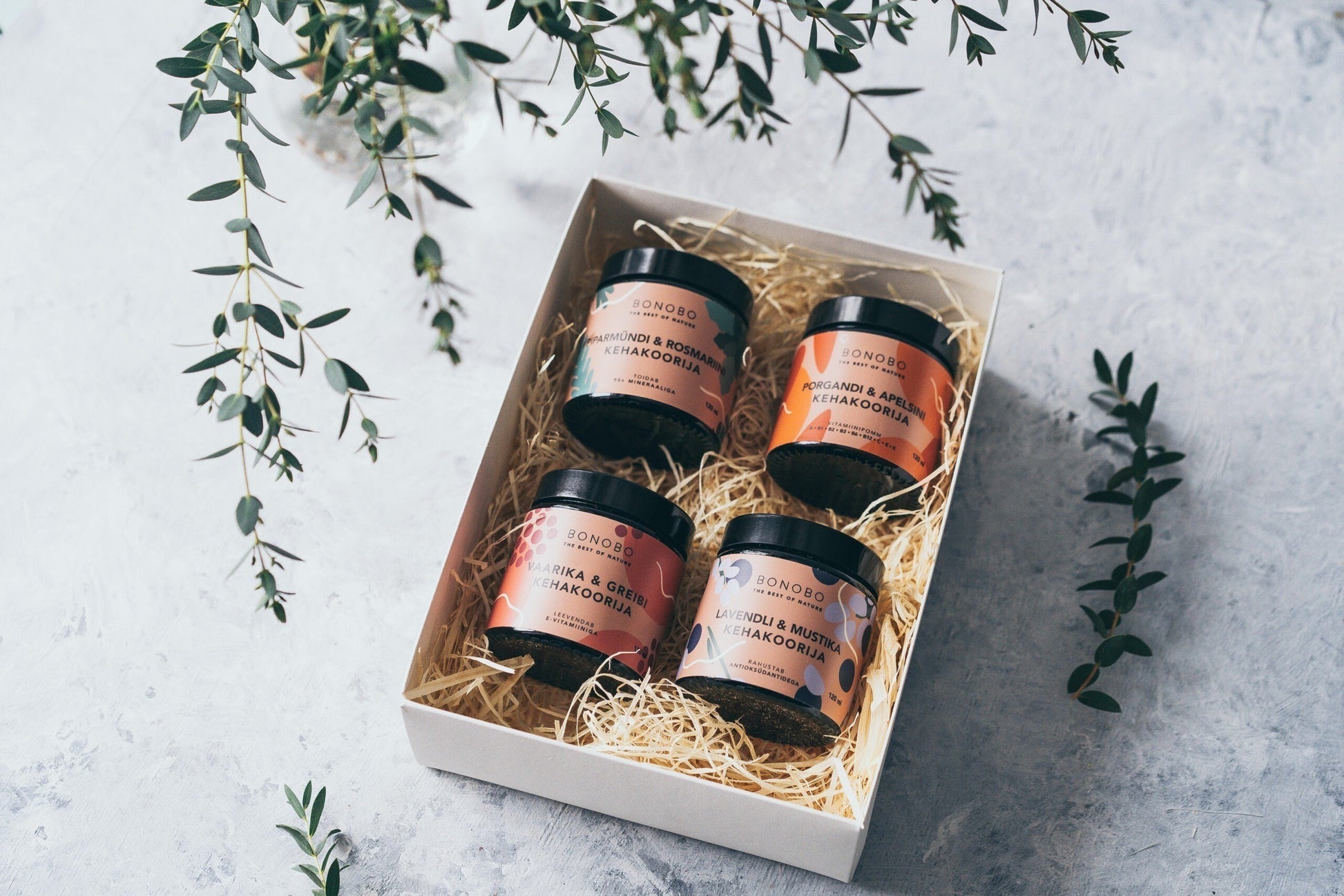bold presentation of the piece of heaven gift box with four vibrant natural body scrubs