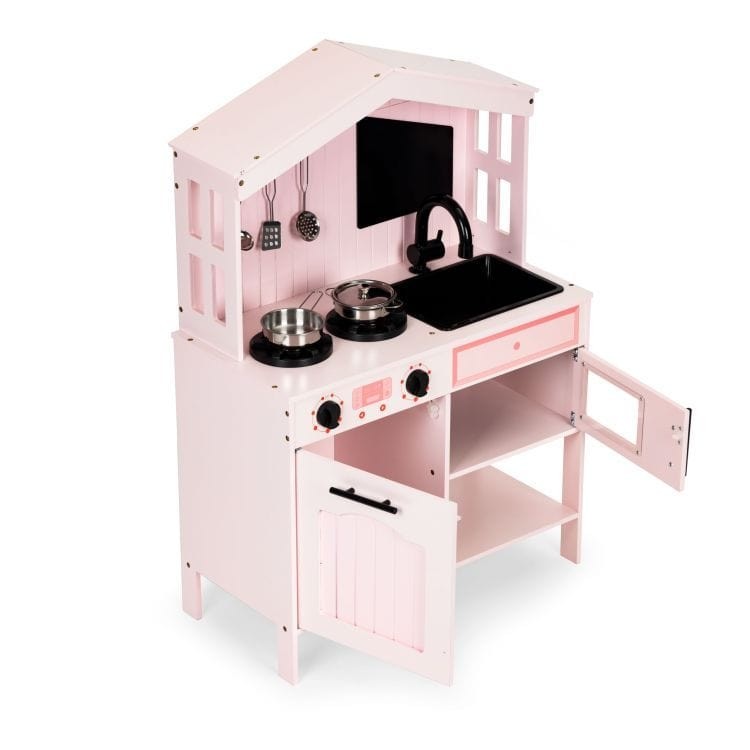 a soft-lit close-up of the pink wooden play kitchen sink and movable faucet