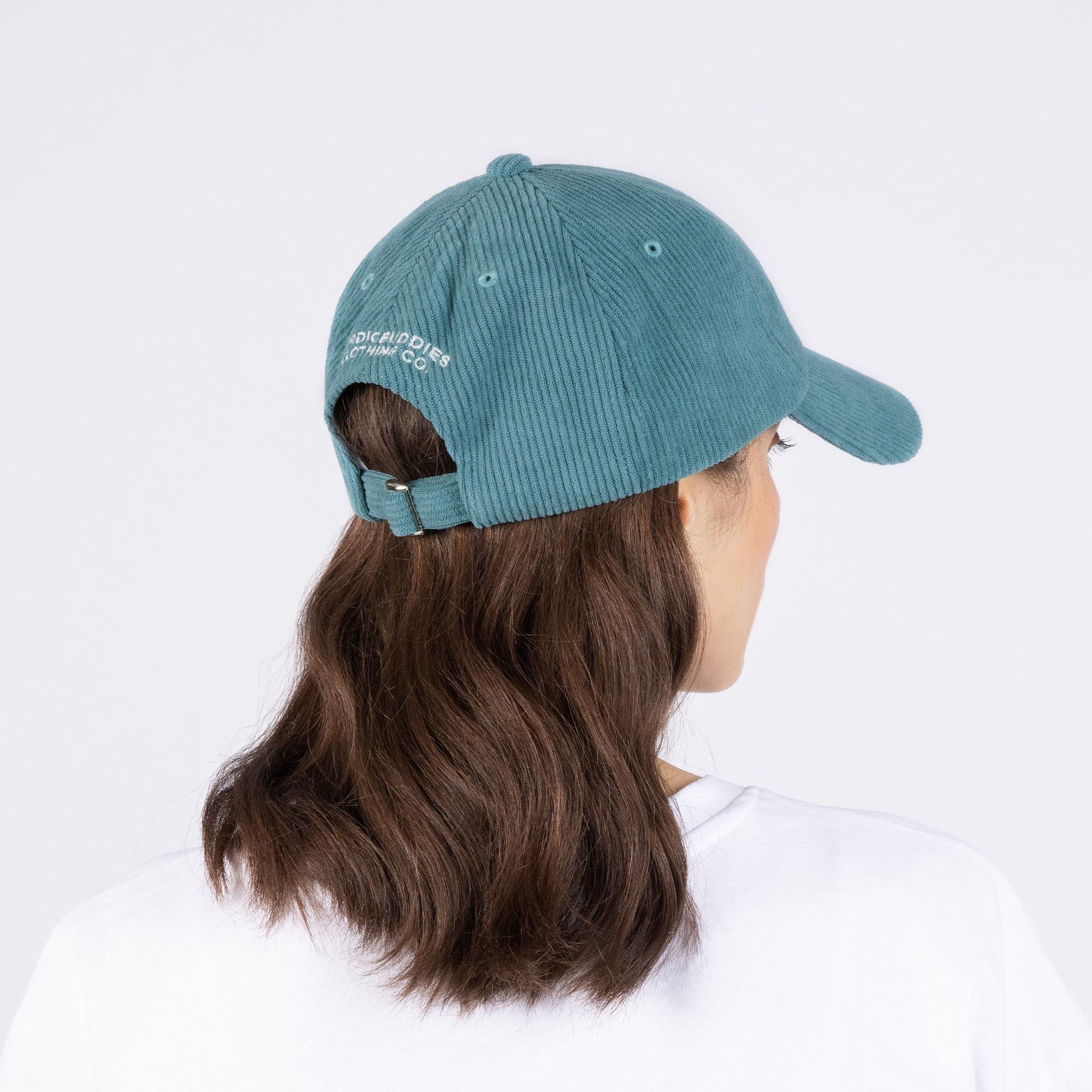 soft petrol blue corduroy dad cap with an adjustable strap for a comforting fit