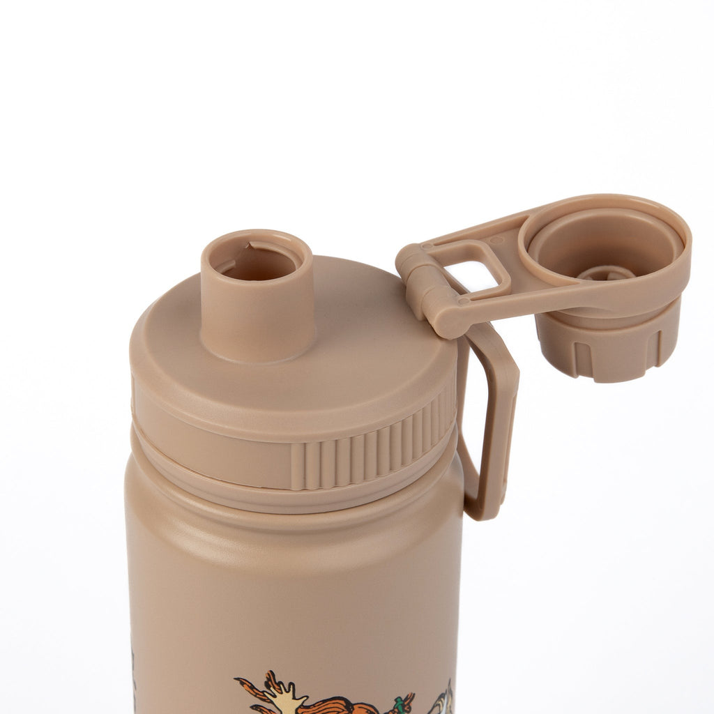 soft beige thermal bottle with morning light on a cozy wooden table