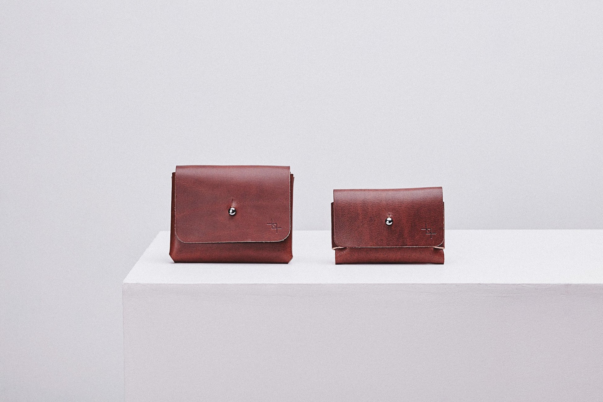 functional minimalist deep pouchie wallet with adjustable strap on a clean background