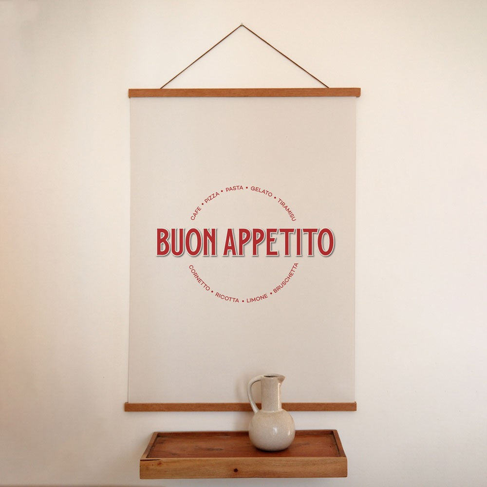 bold buon appetito poster in dramatic lighting on a modern kitchen wall