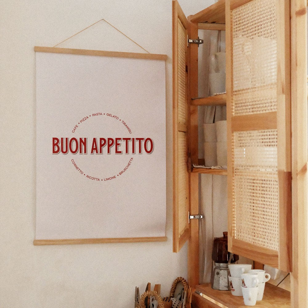 a soft-lit view of the buon appetito poster on a cozy kitchen wall