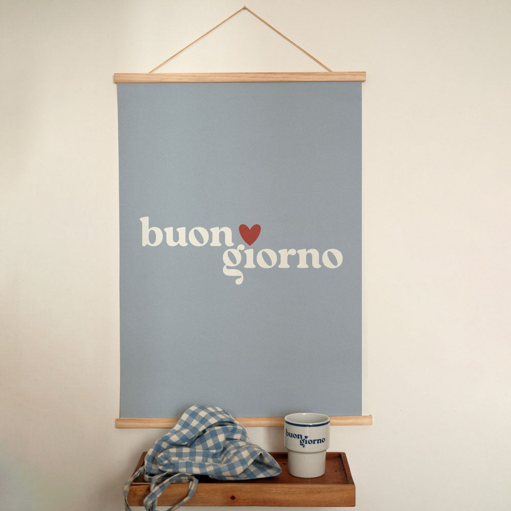 bold minimalist buongiorno poster in dramatic morning light against a dark wall