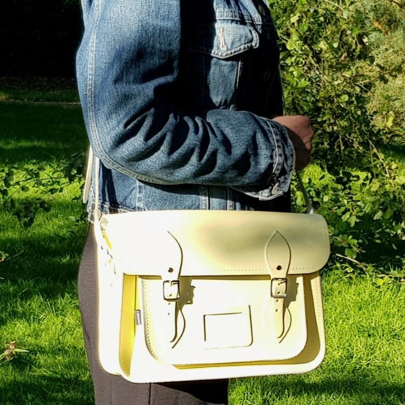 Woman holding a yellow bag in a park setting
