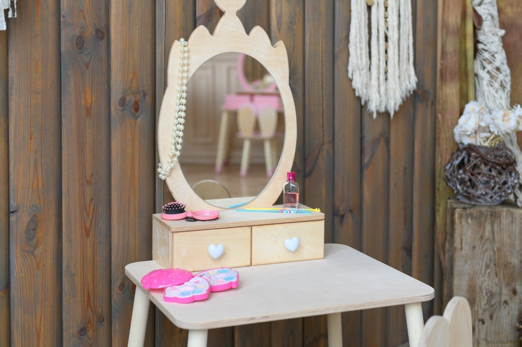 a functional princess beauty table with open drawers showing organized storage for playtime accessories