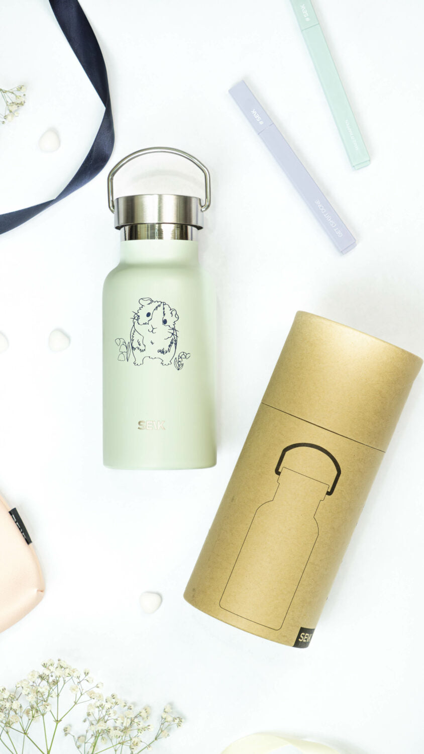 bold light green guinea pig thermos with a confident, modern look on a dark background