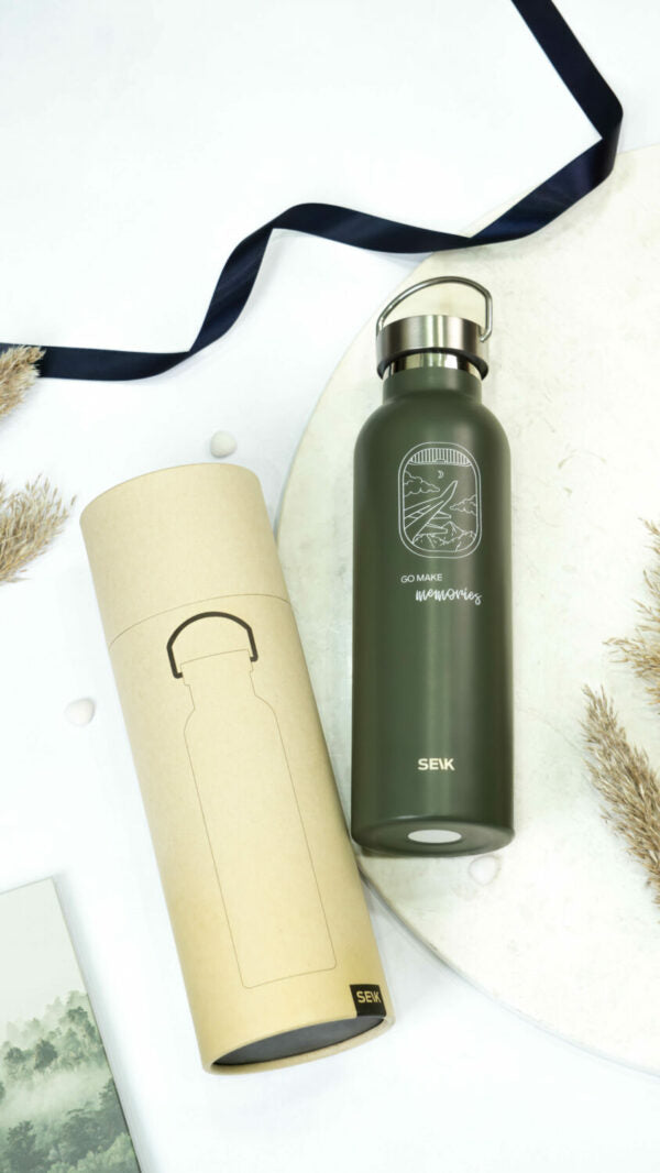 elegant 500ml stainless steel thermos on a marble surface, showcasing its refined leakproof design