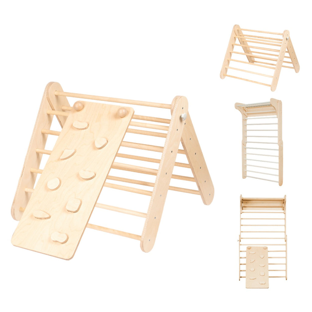 a toddler giggling while sliding down the birch plywood climbing ramp on their belly