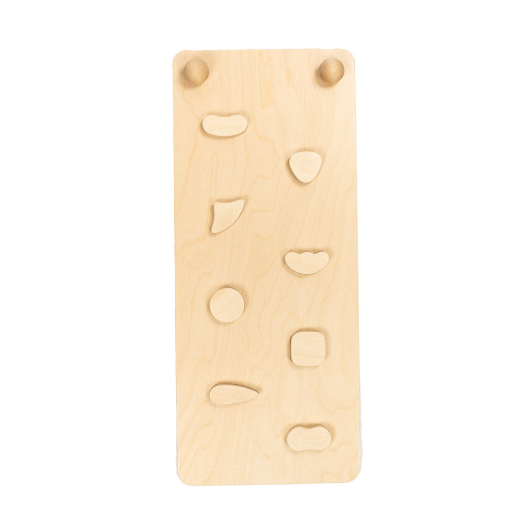 close-up detail of the birch plywood ramp showing its textured rock holds and adjustable hinge mechanism