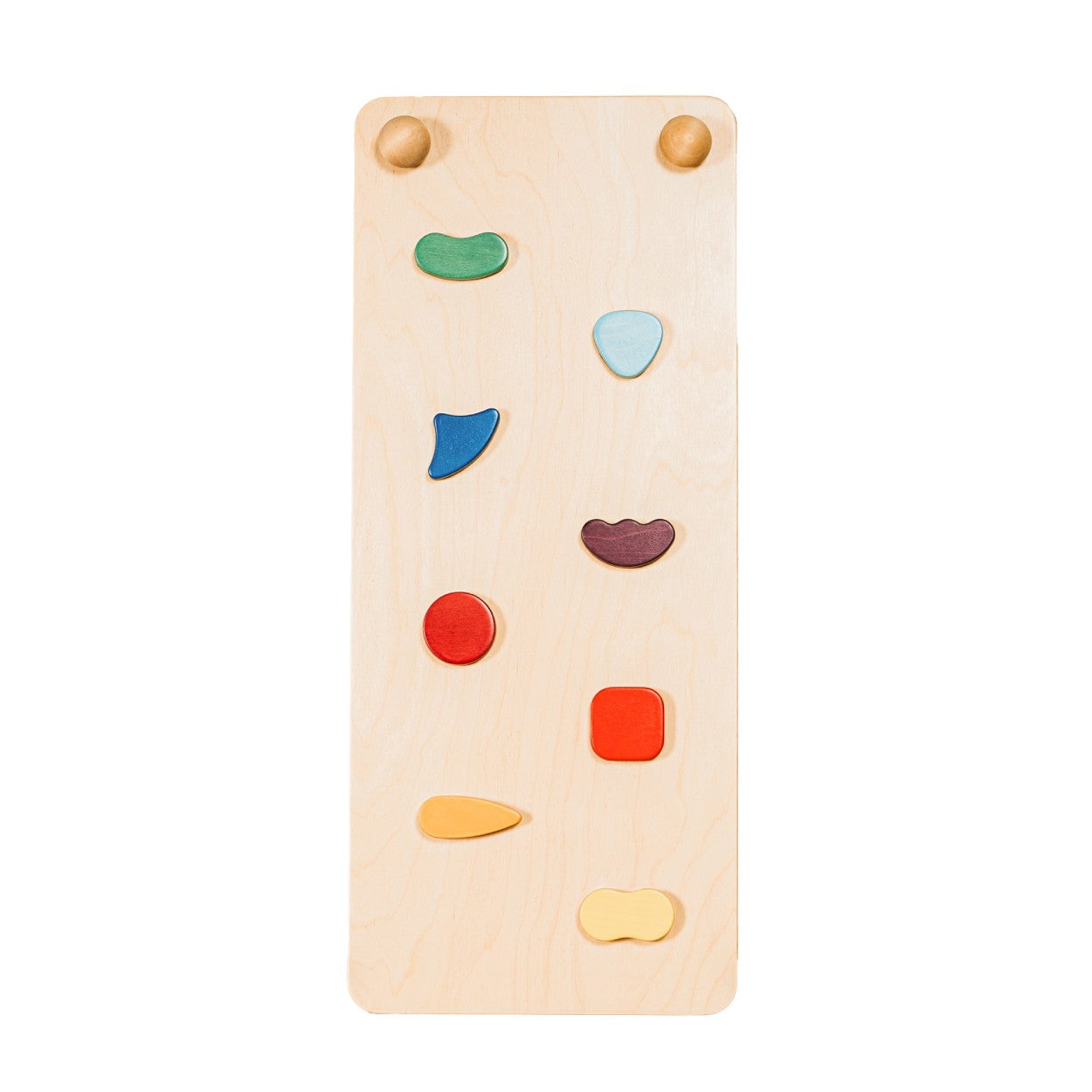 a soft-lit rainbow climbing ramp with gentle scandinavian hues, resting on a cozy nursery rug