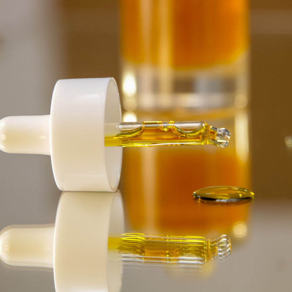 a functional close-up of nörre nordic antioxidant face serum drops on skin