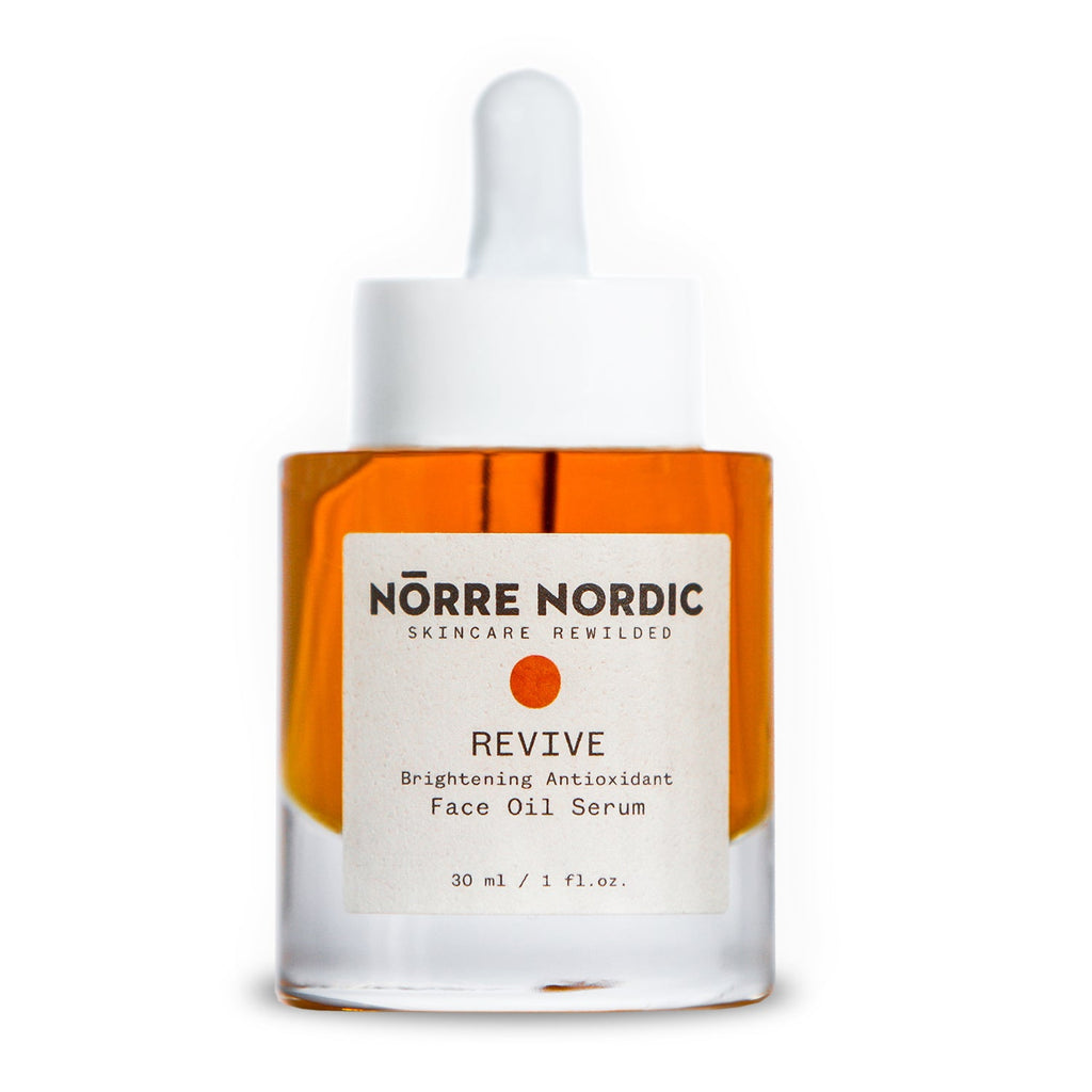 a gentle drop of nörre nordic brightening face oil serum on soft skin