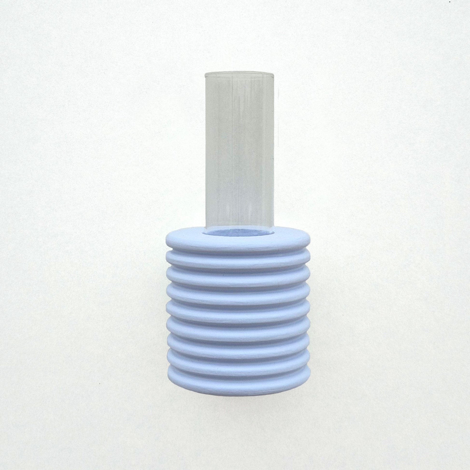 close-up of light blue ribble wall vase mounted on a white wall with a metal hook