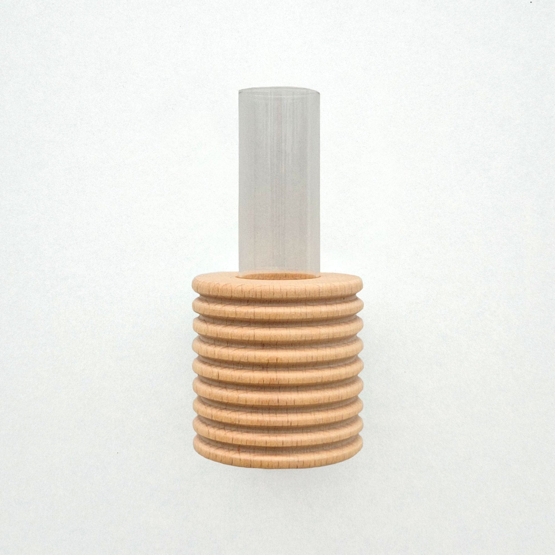 playful blue beech wood wall vase with a single bright yellow flower on a sunny kitchen wall