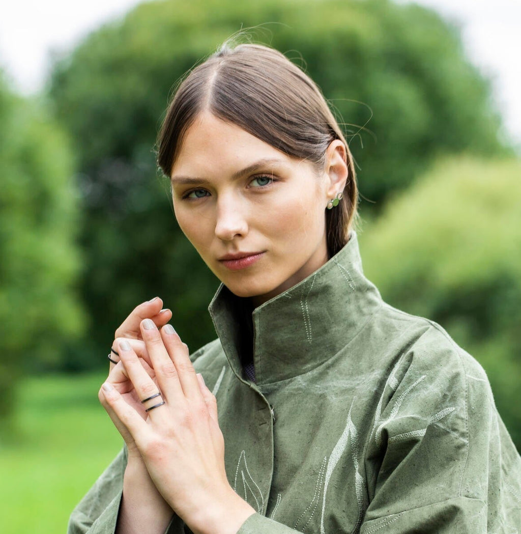 bold purple versus ring with a hypnotic gleam, confidently displayed on a hand