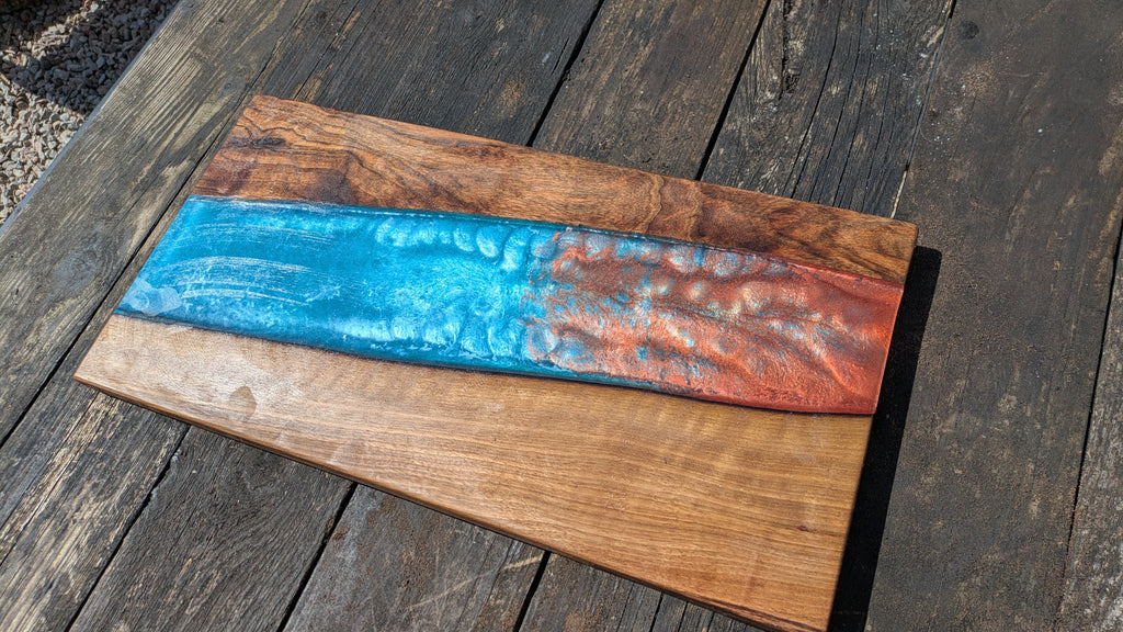 Walnut striking blue and bronze river board
