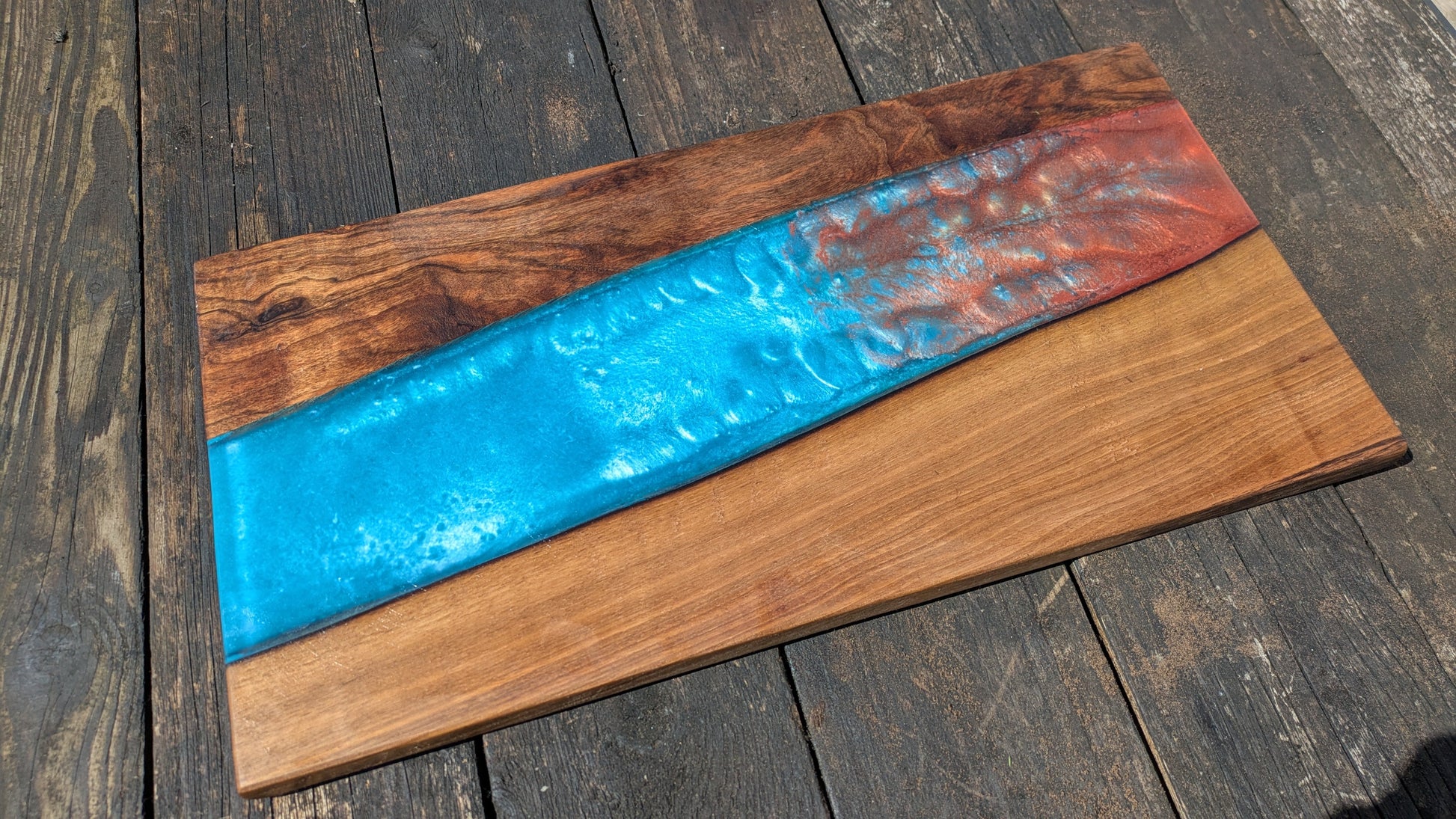 Walnut striking blue and bronze river board