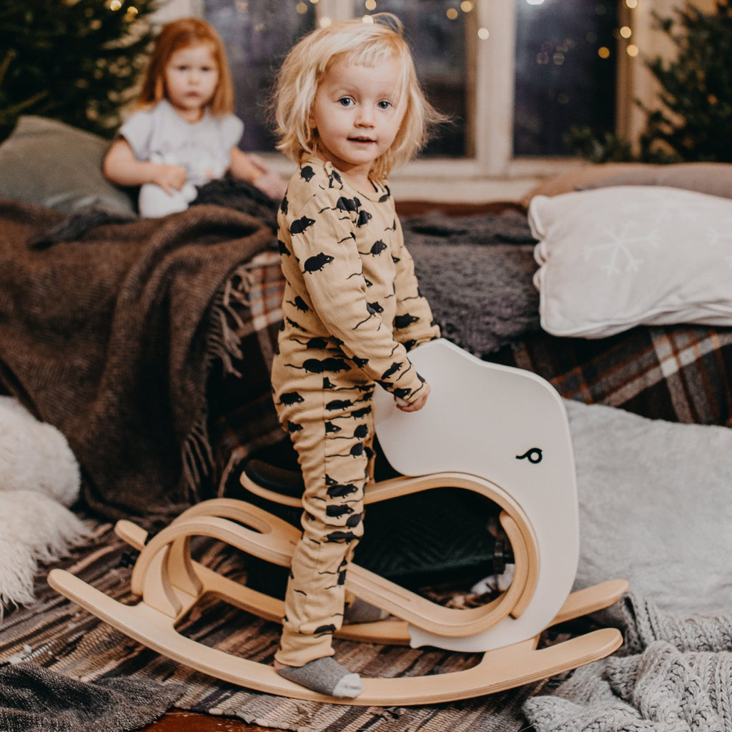 elegant wooden rocking elephant add-on for a balance bike, shown in soft, refined lighting