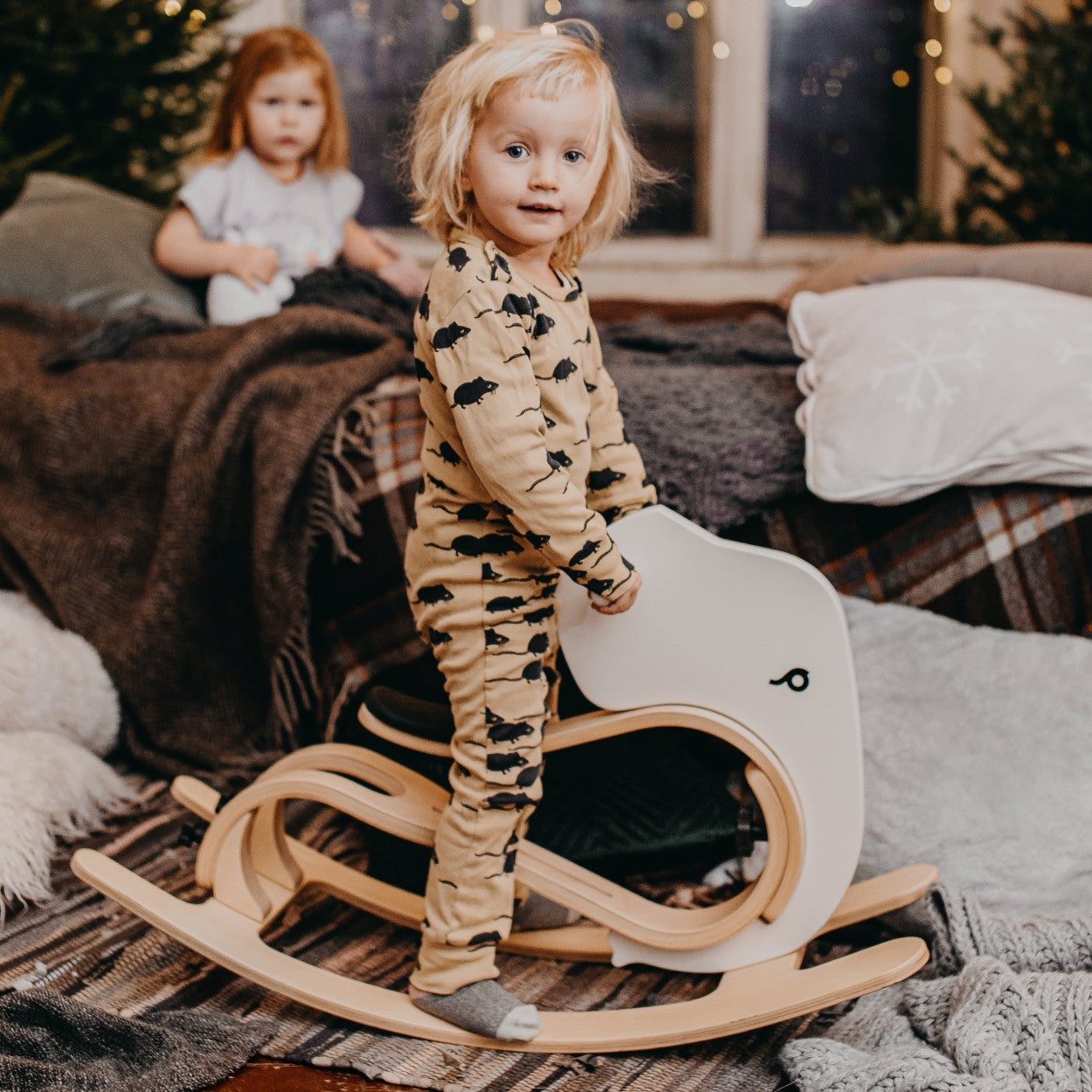 elegant wooden rocking elephant add-on for a balance bike, shown in soft, refined lighting