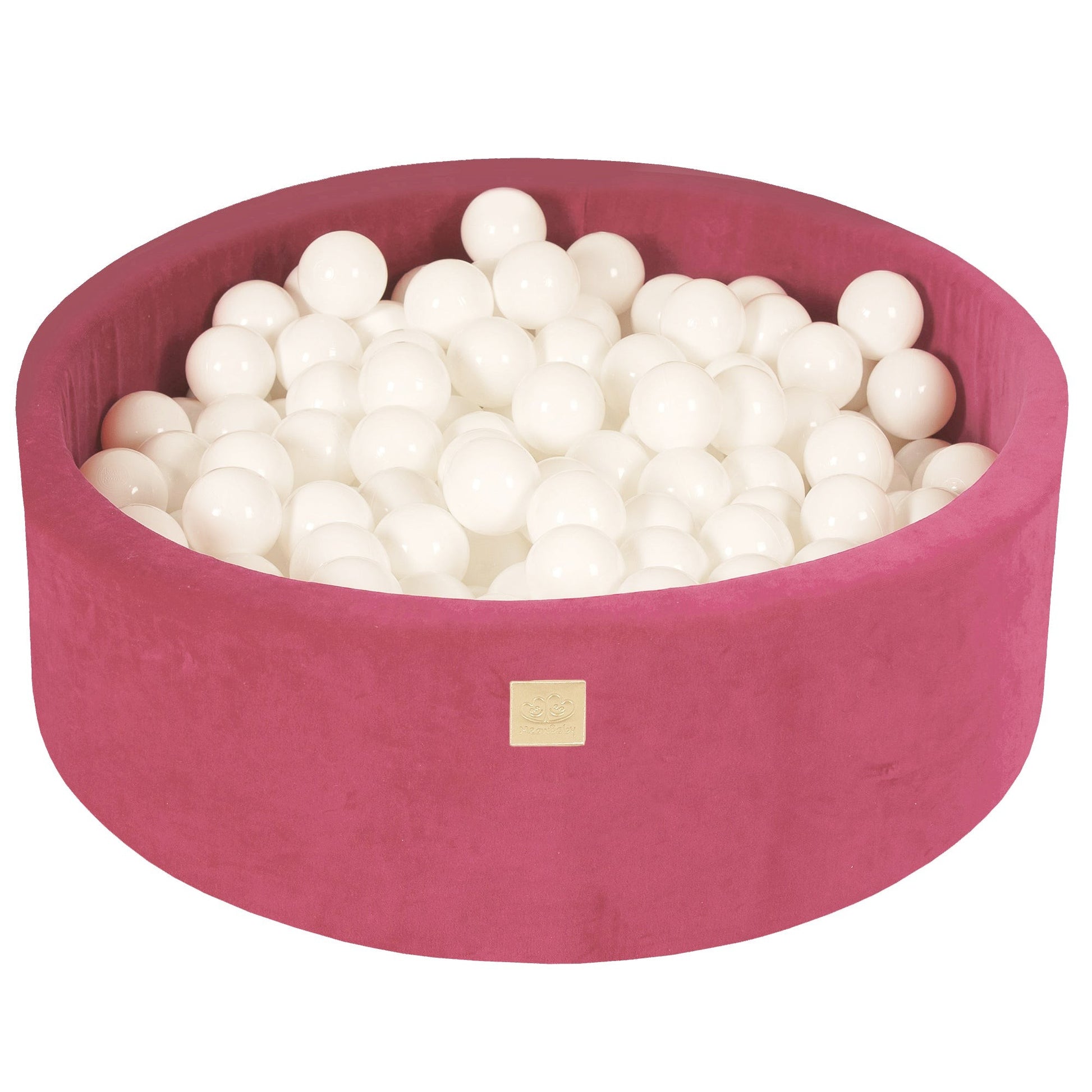 a bold raspberry red velvet ball pit in dramatic lighting, showcasing its plush 5cm walls and 200 white balls