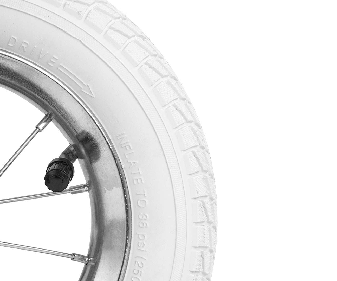 milly mally marshall balance bike for kids on a sunlit garden path