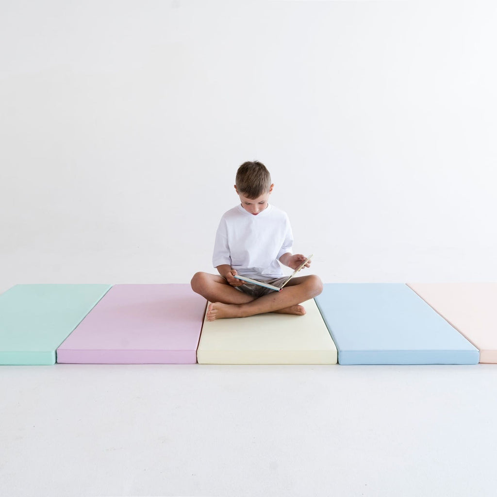 a soft pastel iglu play mat set arranged in a nursery corner for safe crawling and imaginative play