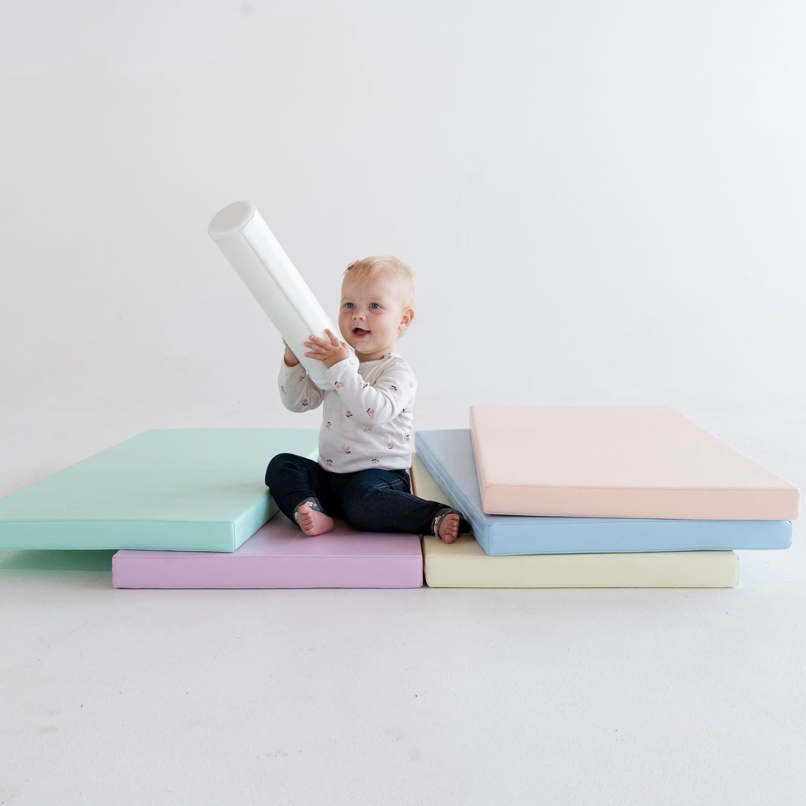 bold overhead shot of a full iglu 5-piece pastel play mat set arranged on a clean floor