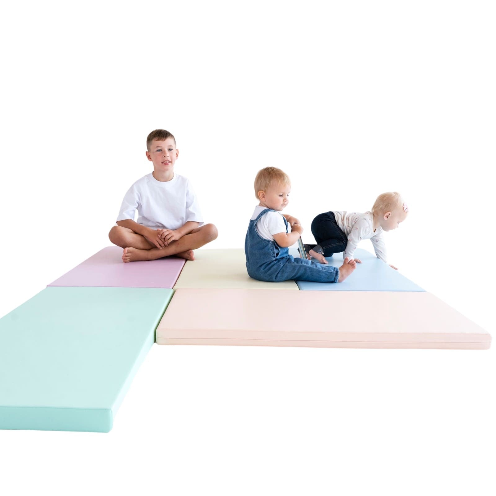 soft pastel play mat set arranged in a playful igloo shape for a baby's room