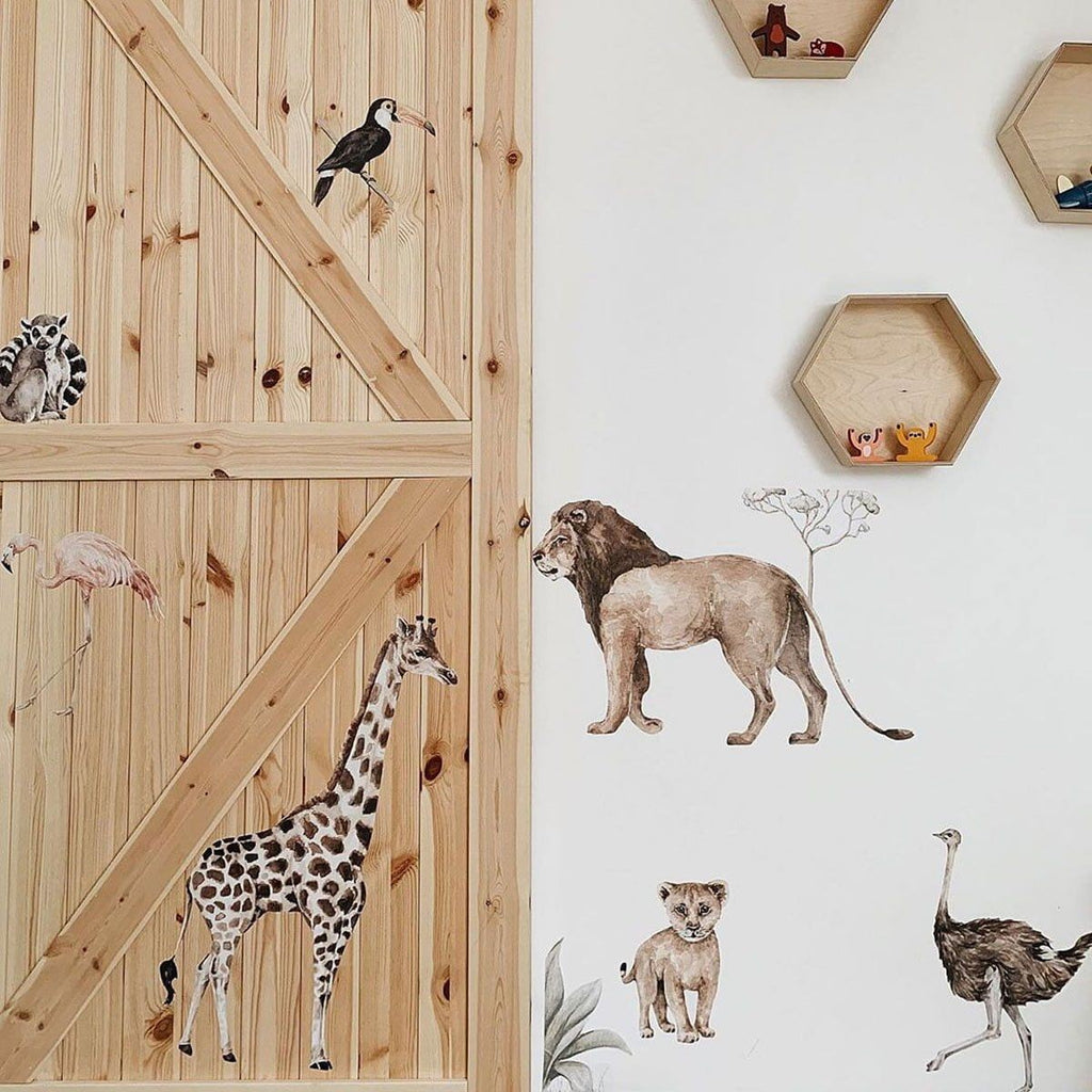 playful savanna wonderland wall stickers with a lemur and toucan peeking from behind a giraffe