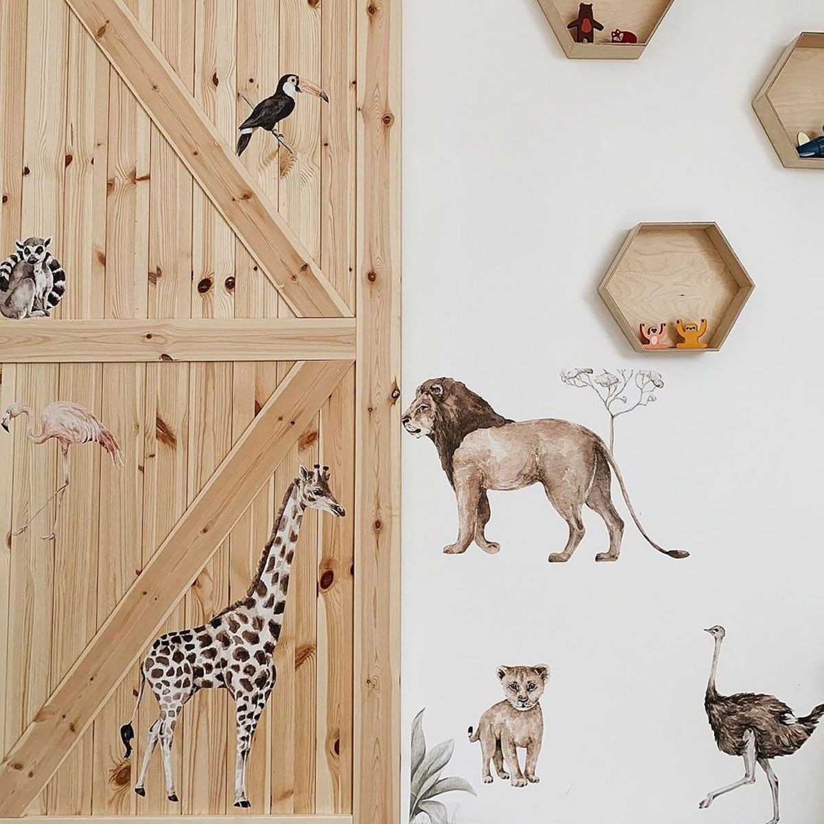 playful savanna wonderland wall stickers with a lemur and toucan peeking from behind a giraffe