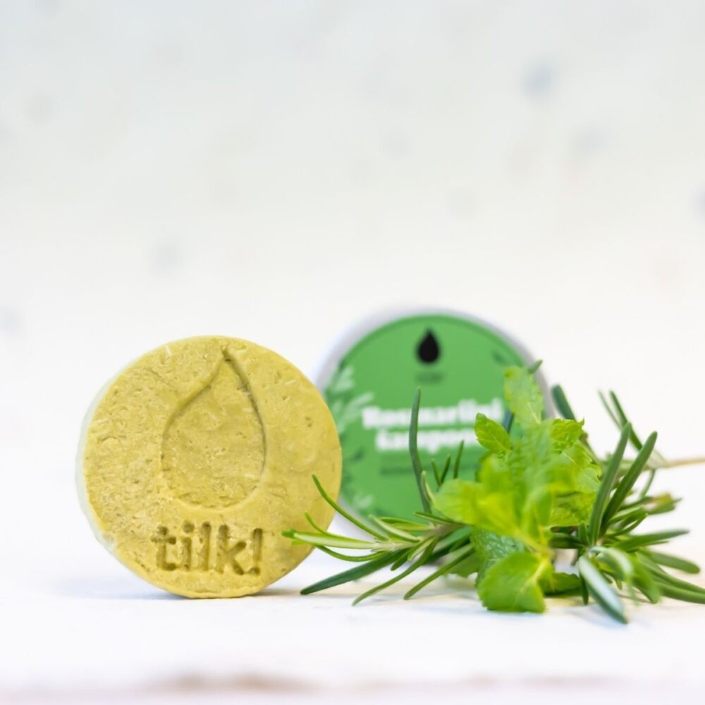 bold close-up of a vibrant green matcha shampoo bar with visible rosemary flecks