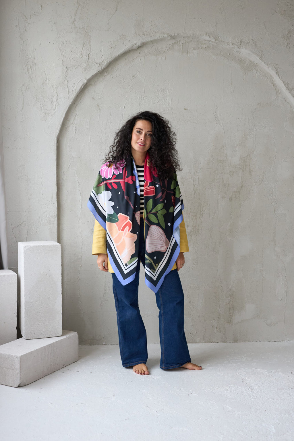 soft leopard print summer scarf draped gently over a sunlit wicker chair