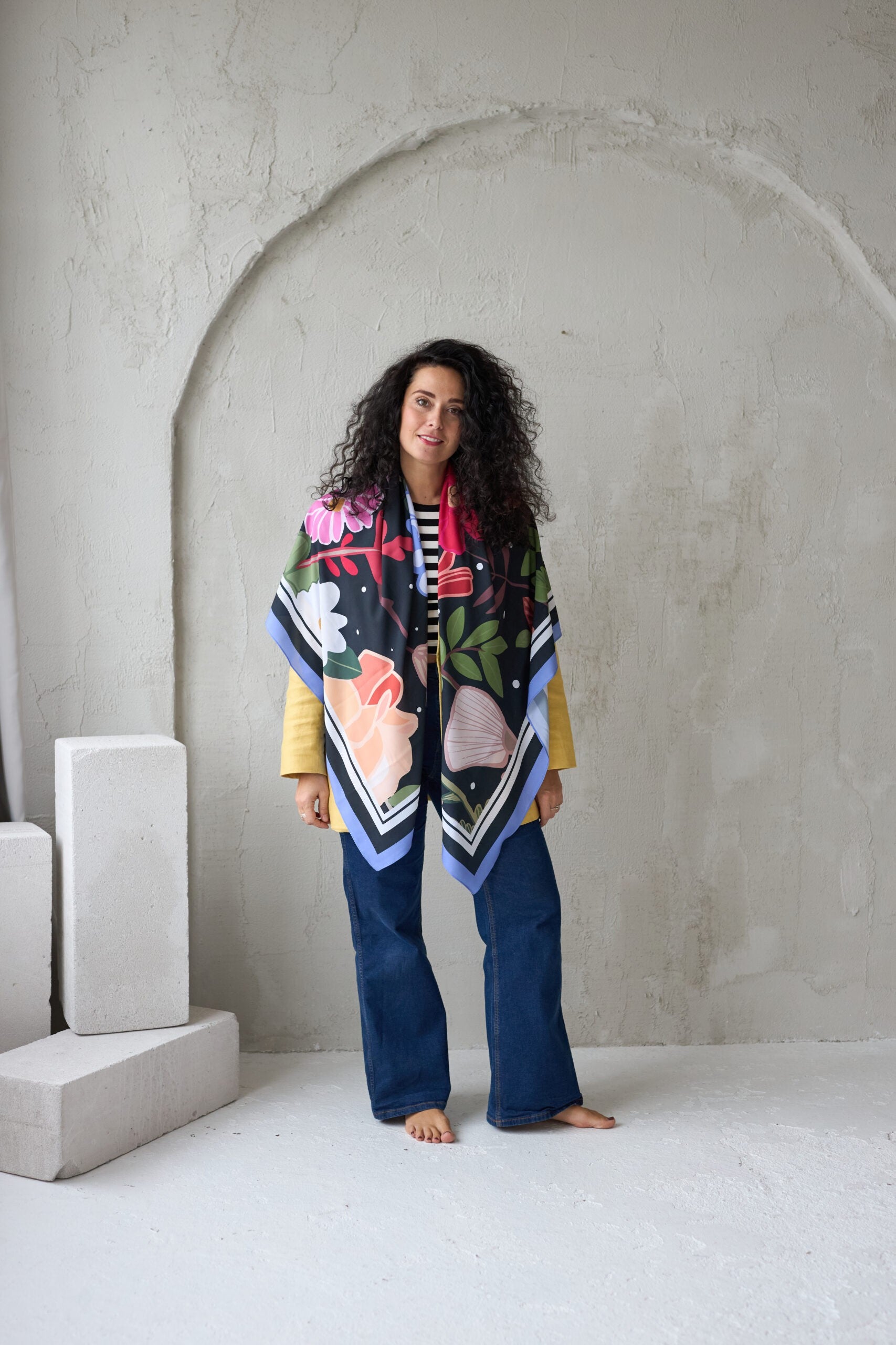 soft leopard print summer scarf draped gently over a sunlit wicker chair