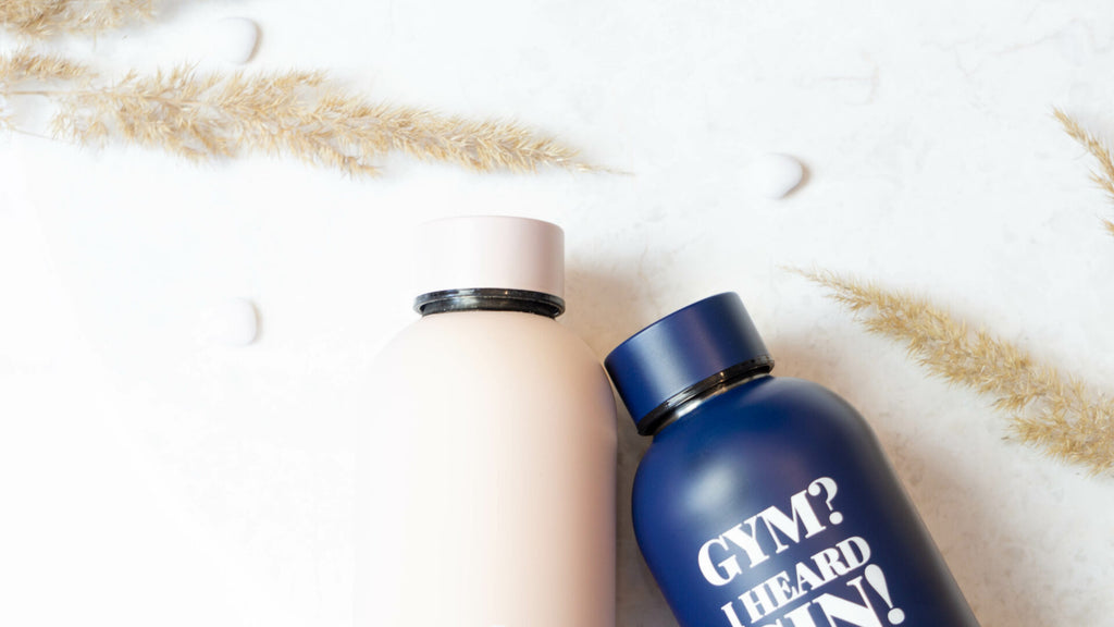 bold dark blue thermos with gym i heard gin slogan on a gritty gym floor