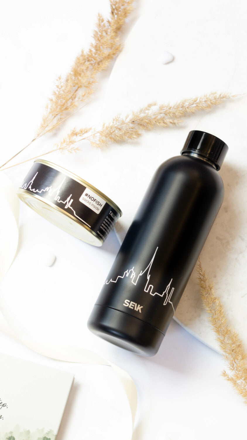 a soft matte water bottle with a gentle view of tallinns old town from the sea