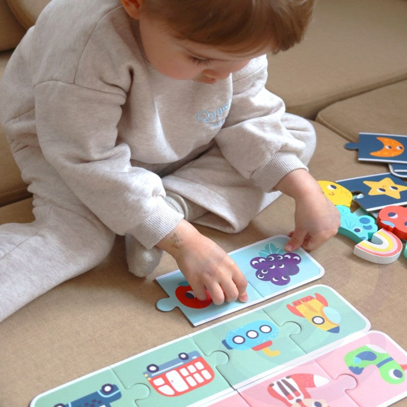 confident child playing with the woopie green sensory memory puzzle, focused on tactile matching