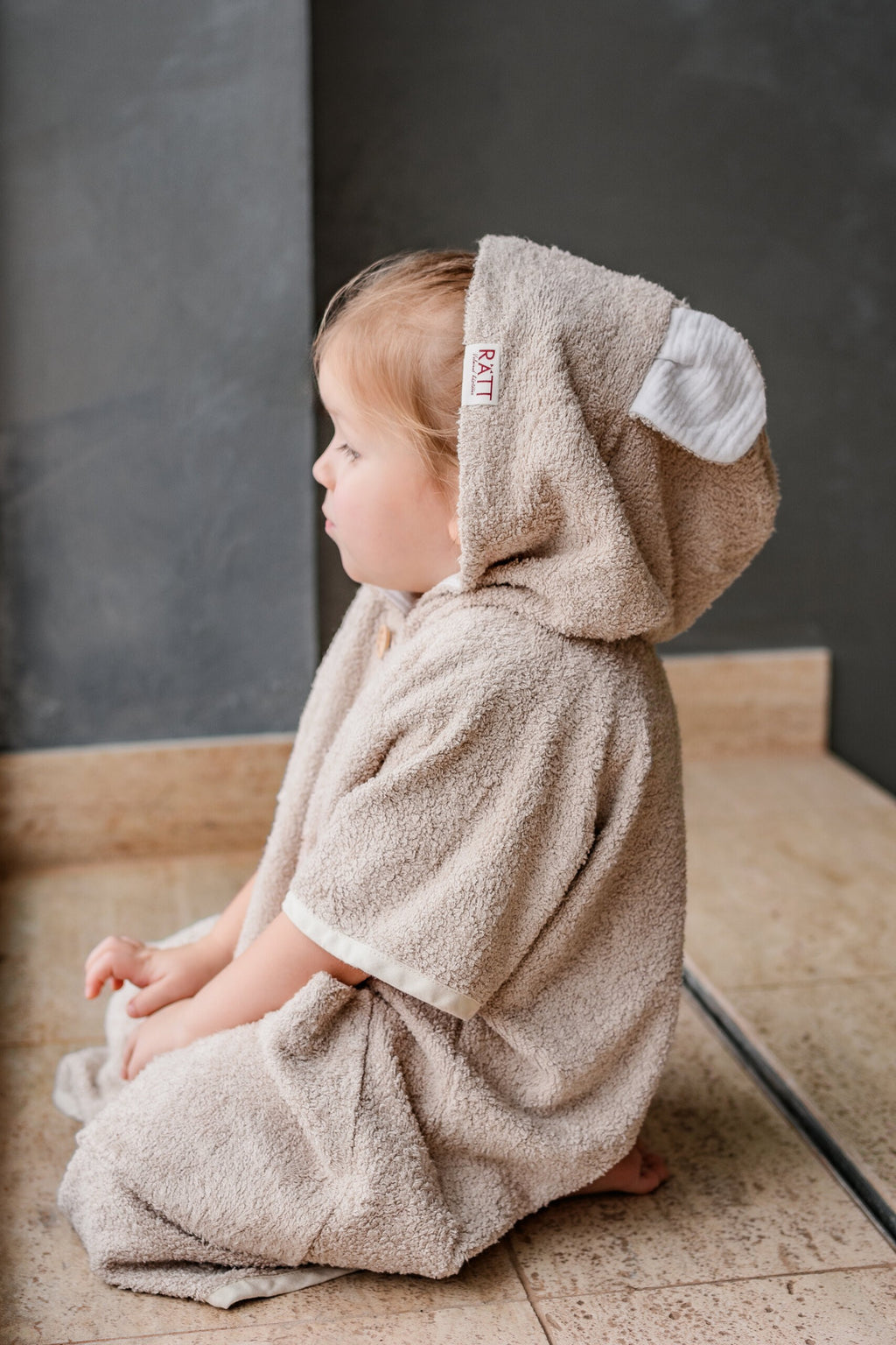 bold toddler in cozy bamboo poncho with hood and pockets, post-swim confidence