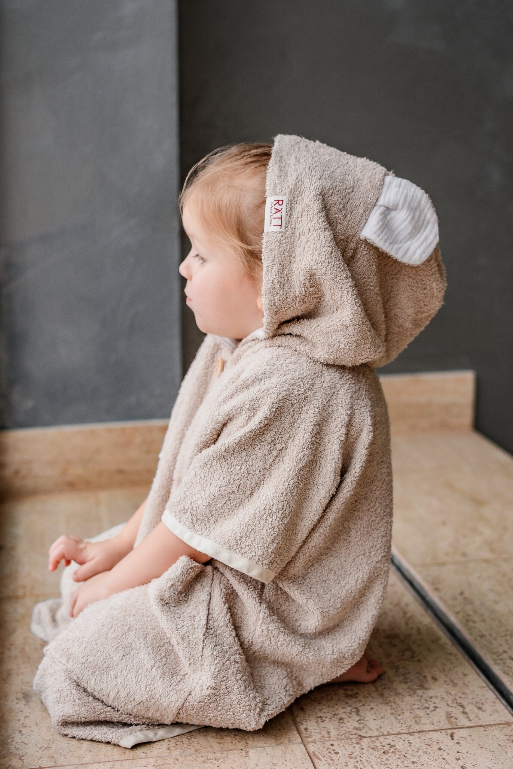 bold toddler in cozy bamboo poncho with hood and pockets, post-swim confidence
