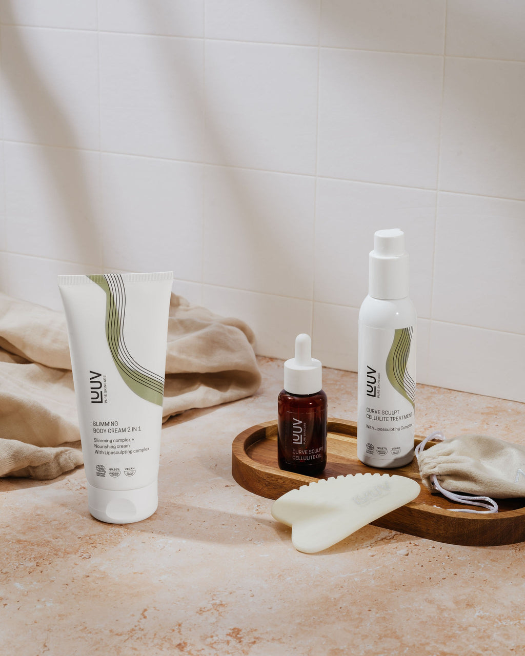 softly lit nourishing slimming cream jar with shea butter and aloe, resting on a calming natural linen background