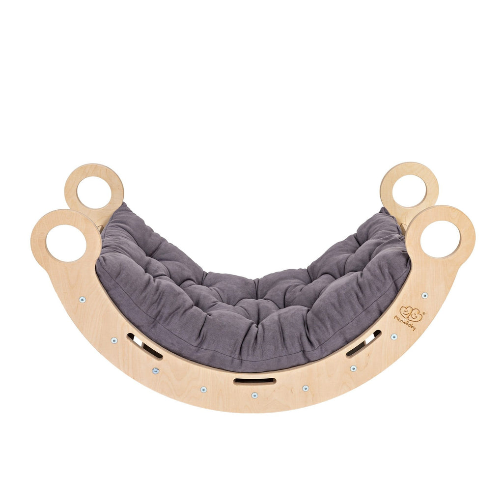 a child peeking through the snug rocker tunnel in a cozy nursery corner