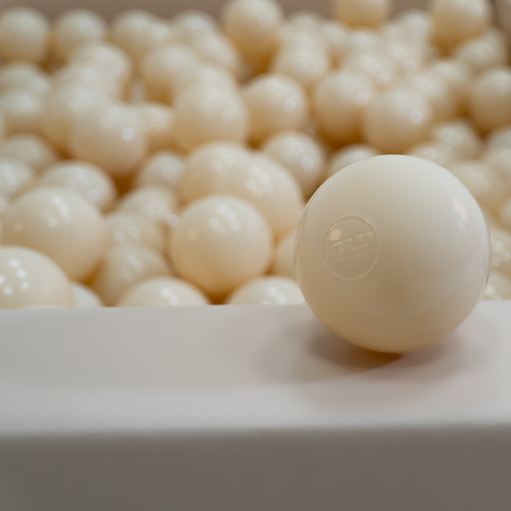 elegant beige ball pit balls in a sophisticated nursery setting