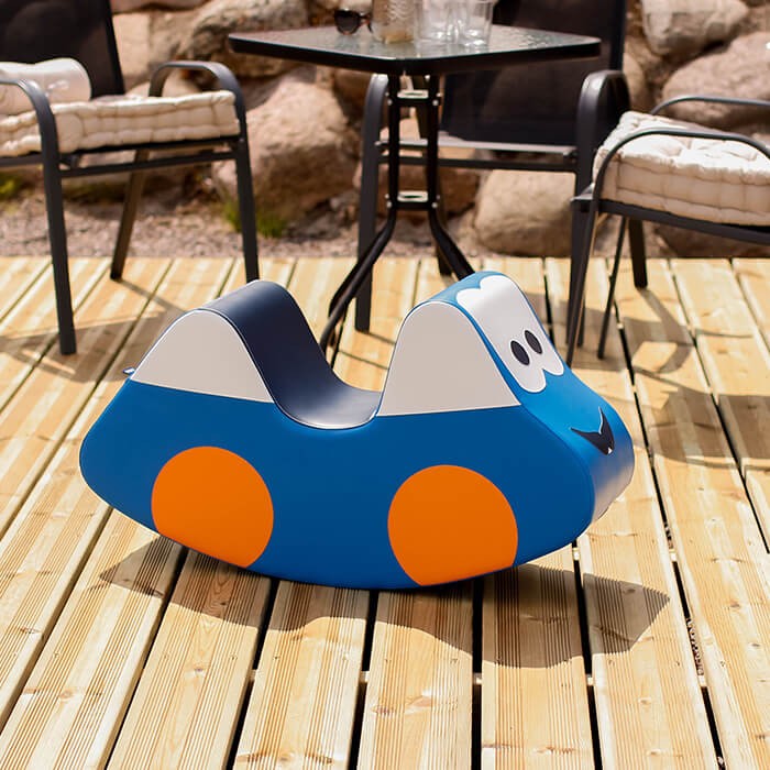 elegant blue soft play car ride-on toy for kids displayed as stylish nursery decor