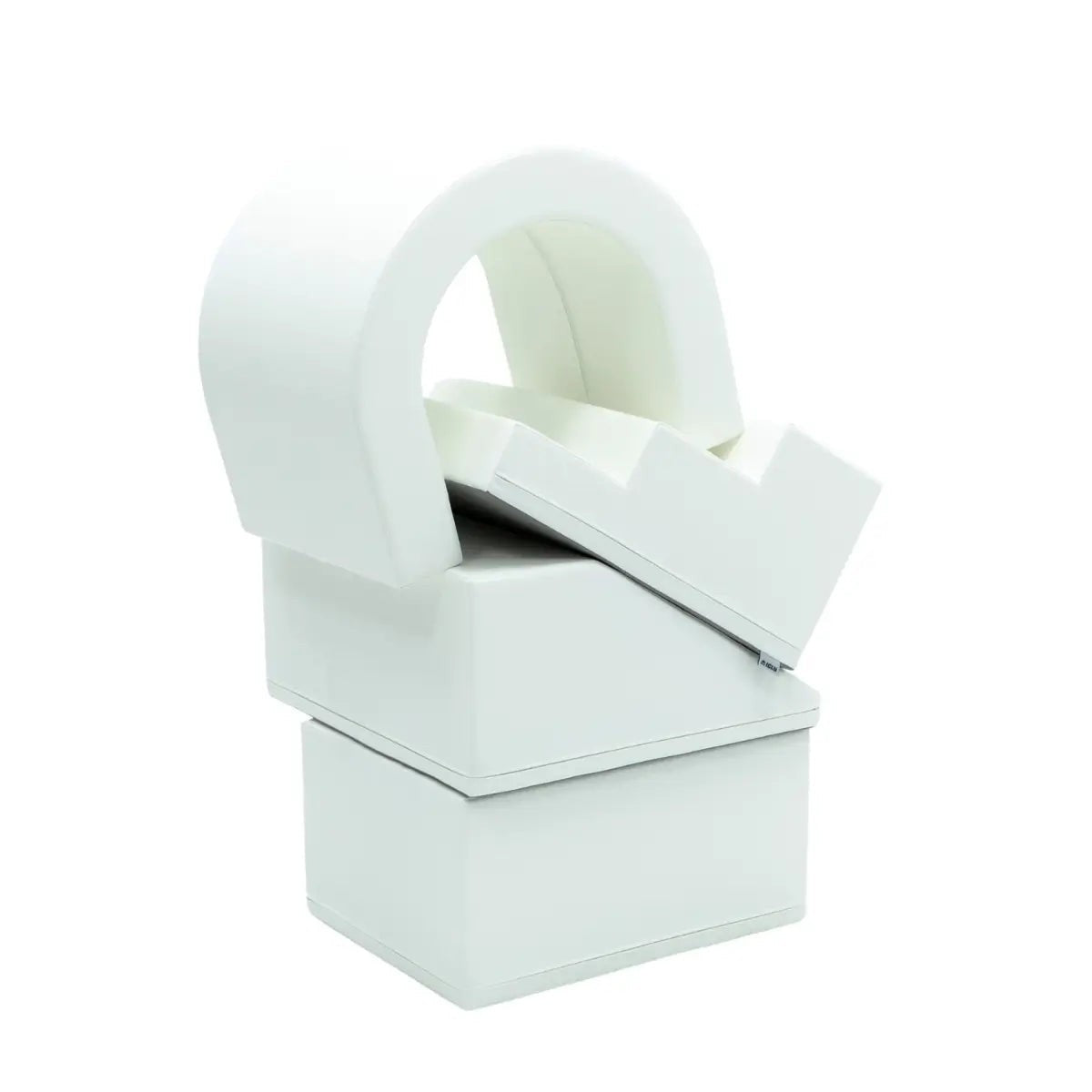 a child's hand reaching out from the white iglu soft play tunnel, inviting adventure