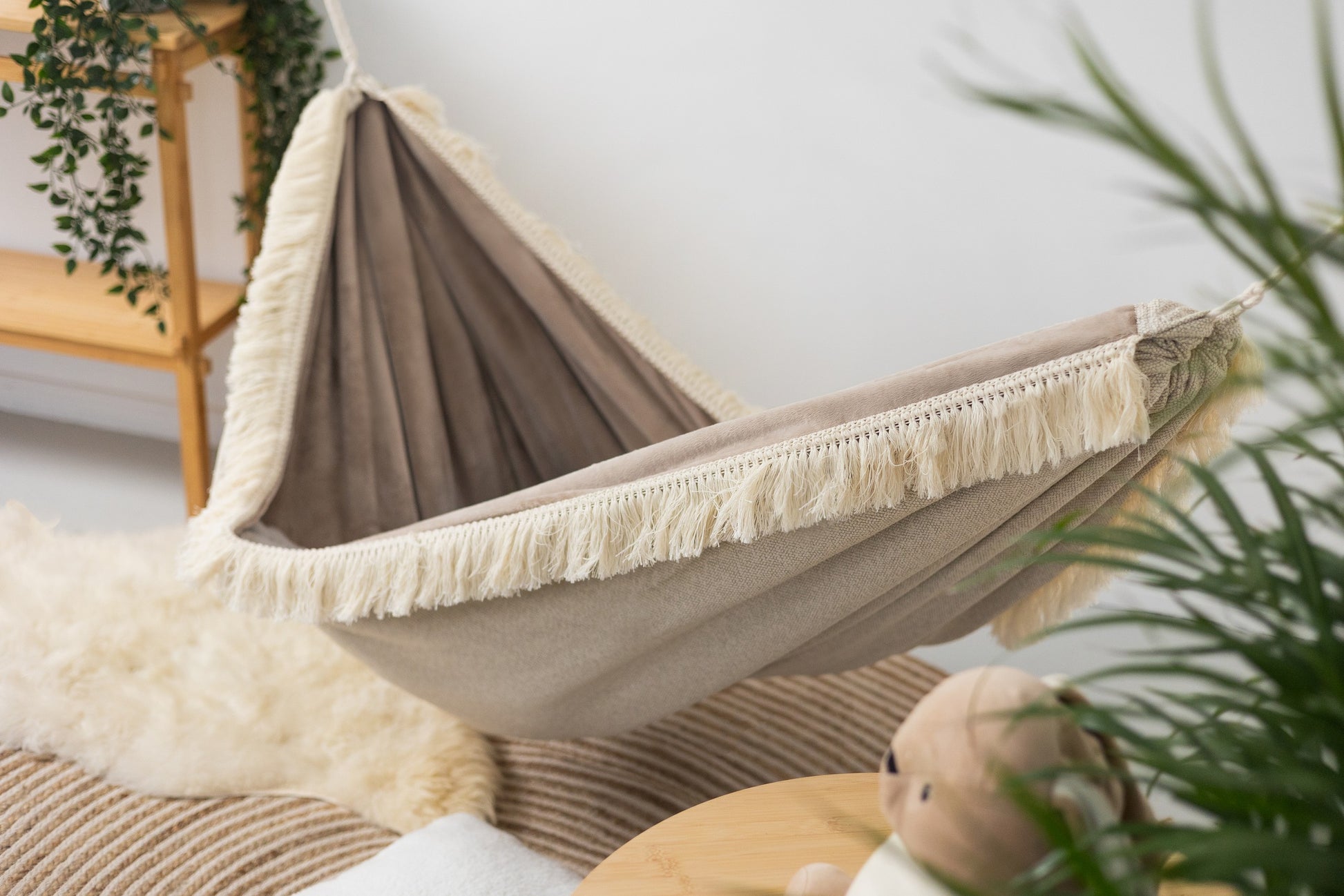 Feather Dream Hammock for Kids - Cozy & Safe Handmade Retreat with Magical Fringes and Soft Beige Fabric by Sówka at www.brixbailey.com