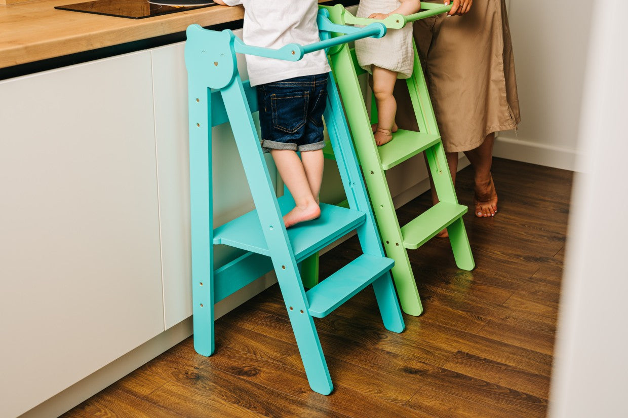 foldable baltic birch step stool for kids folded flat against a wall