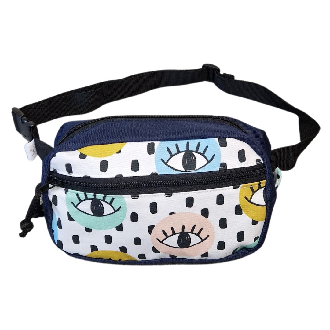 playful all-seeing eyes waist bag on a sunny park bench with a water bottle