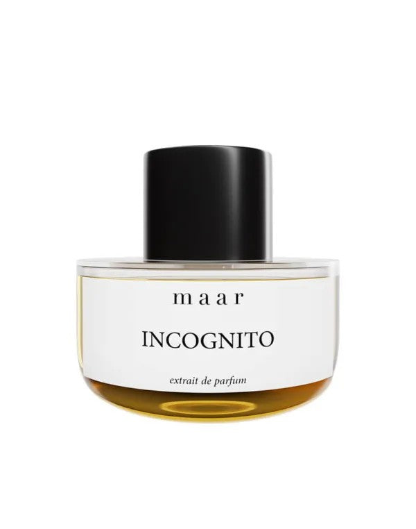 bold close-up of incognito spray perfume bottle with amber liquid, capturing its mysterious and long-lasting unisex fragrance