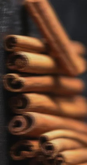 playful spritz of nights in morocco perfume with bergamot and oud on a sun-drenched table